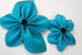 Blue Satin faced organza flower pin with  fabric center; measurements: