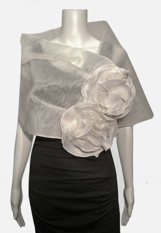 This silk organza evening wrap features two jumbo flowers, pleating detail and a snap closure. It measures 51" x 14" and is a welcome addition to any woman's wardrobe.