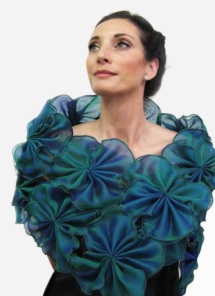 This is a turquoise metallic silk organza flower wrap made of 64 individual pieces that are then attached to form this beautiful evening wrap.