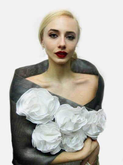 This floral wrap is made of metallic silk organza and features a fold down collar and 5 flowers made of a combination of satin organza and silk organza. The piece is available in all black, for a very dramatic look, but the flowers are also available in colors - rose, orange and pink. Another combination is silver with white flowers. It has a snap closure and but as with all the styles, can be customized for larger sizes.