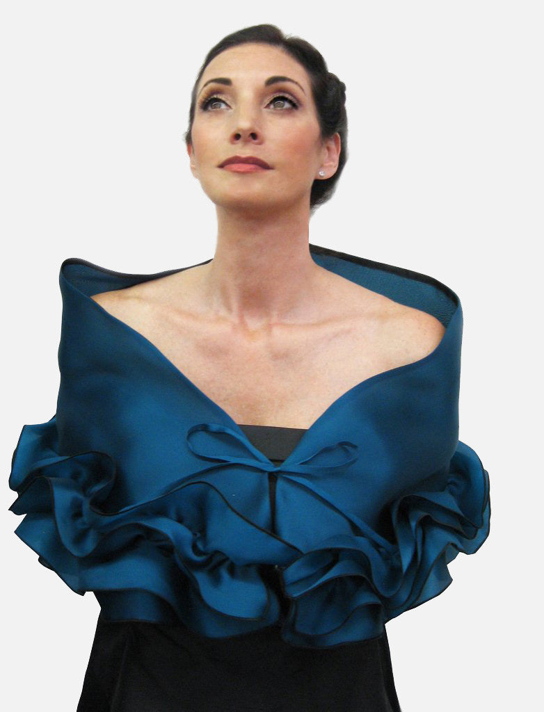 This elegant, satin organza evening wrap can be made with a snap closure or with ties, depending on preference. It measures 50" x 15" and can be customized for larger sizes. A beautiful addition to any woman's wardrobe, it features a rouched double ruffle at the bottom. This luxurious piece is the perfect cover up for an evening dress or gown.