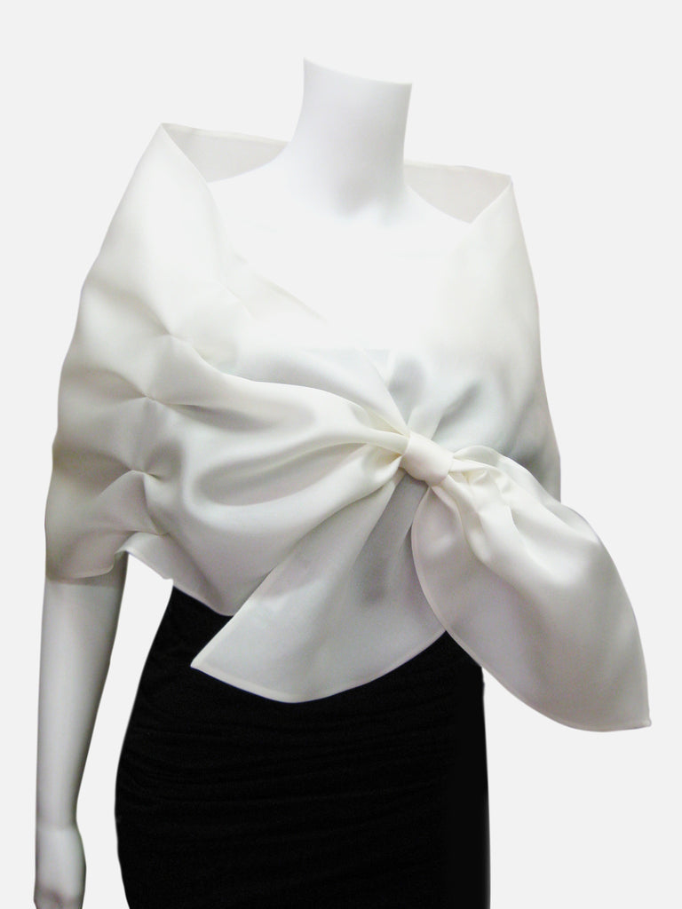 White Satin faced organza wrap with pleated detail and loop closure.