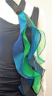 Choker in Six 20" long streamers in colors, blue, green, turquoise, on a black band; snap closure. 