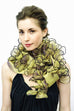 This versatile evening wrap is made of metallic silk organza and features 48 petals. The ends are narrow, allowing the piece to be tied to create several stunning variations. These include wearing this wrap with the petals near the neck, turning it up side down and folding the collar so that the petals are at the bottom; tying the ends in the back to create a shrug, or folding and draping around the neck to make a boa .3