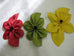 Red, Green, Yellow silk flower pin with fabric center.  May be worn on sweaters, jackets, coats, hats, handbags, etc.  Hand made of satin faced organza. Measures 10" x 6"