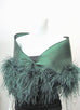 This is a 100% silk evening wrap made of satin faced organza and lined with silk organza. It features ostrich feathers at the border, a tie closure and measures 49" x 13' but can be customized for larger sizes. Available in several colors, it is a bold, dramatic statement piece for your special occasion, green.