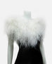 White ostrich feathers on silk organza backing and tie closure.