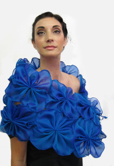 This is a blue metallic silk organza flower wrap made of 64 individual pieces that are then attached to form this beautiful evening wrap.